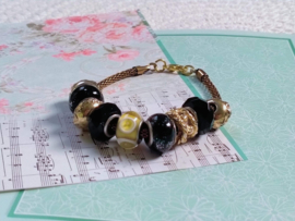 Zwart met gouden pandora style armband