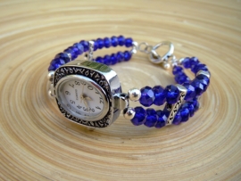 Horloge met diepblauwe glasrondellen