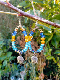 Turquoise en oranje Buddha oorbellen