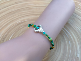 Skull armbandje in  groen en goudkleur