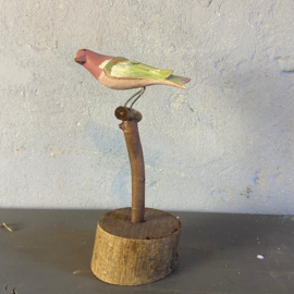 Houten vogeltje op stok