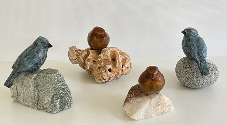 Bronzen vogelbeeldjes