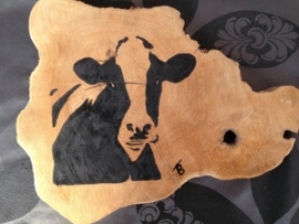 Teak wooden disk painted with cow.