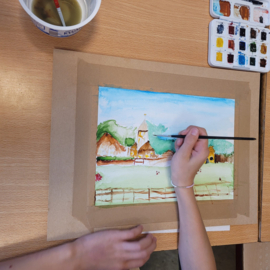 Les: buiten landschap tekenen en in de klas aquarelleren.