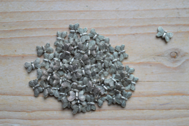 Metalen tussenkraal vlinder ca. 6 x 10 mm per 10 stuks