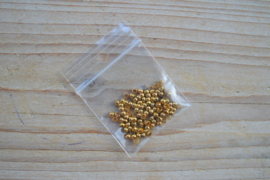Goudkleurige knijpkralen ca. 3 mm ca. 80 stuks