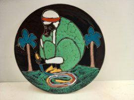 Man in groene kleding met een slang 27 cm. / Man in green clothes with a snake 27 cm.