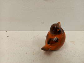 Oranje vogeltje voor in een wandrekje / Orange bird for in a wall rack