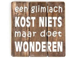 Tekstbord "Een glimlach kost niets maar doet wonderen"
