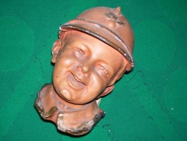 Moneybank made of terracotta Child with a French helmet nice item