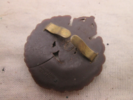 British plastic capbadge of the Royal Engineers with maker.