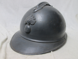 French helmet Casque Adrianne, M-1915 with infantry badge. Franse helm Model 1915 met infanterie embleem in een perfekte staat.