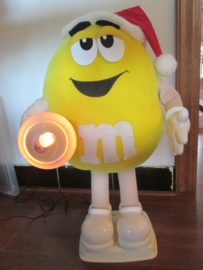 M&M  commercial shopping window figure in Christmas outfit with lamp. M&M etalage figuur in kerst sfeer met lamp.