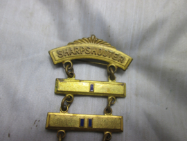 US sharpshooter badge of the NRA. National Rifle Association, Junior Division,  Amerikaans embleem scherpschutter bij de NRA