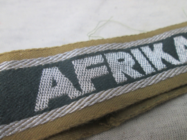 German BeVo- like Cuff-title AFRIKA KORPS. Duitse mouwband BeVo- Afrika-Korps gedragen staat uniform-removed. Ärmelstreifen D.A.K..