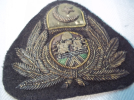 Pet embleem van een Oosterse vliegtuigmaatschappij. piloten pet embleem officier. Maleisie, Siam