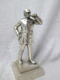 Beeld brandweerman, verzilverd, als prestatie prijs. 6-6-1966 te Luyksgestel (NL). voorstellende een Brabweermen met leren helm en toeter. Statue of a firefighter as reward for a good prestation.