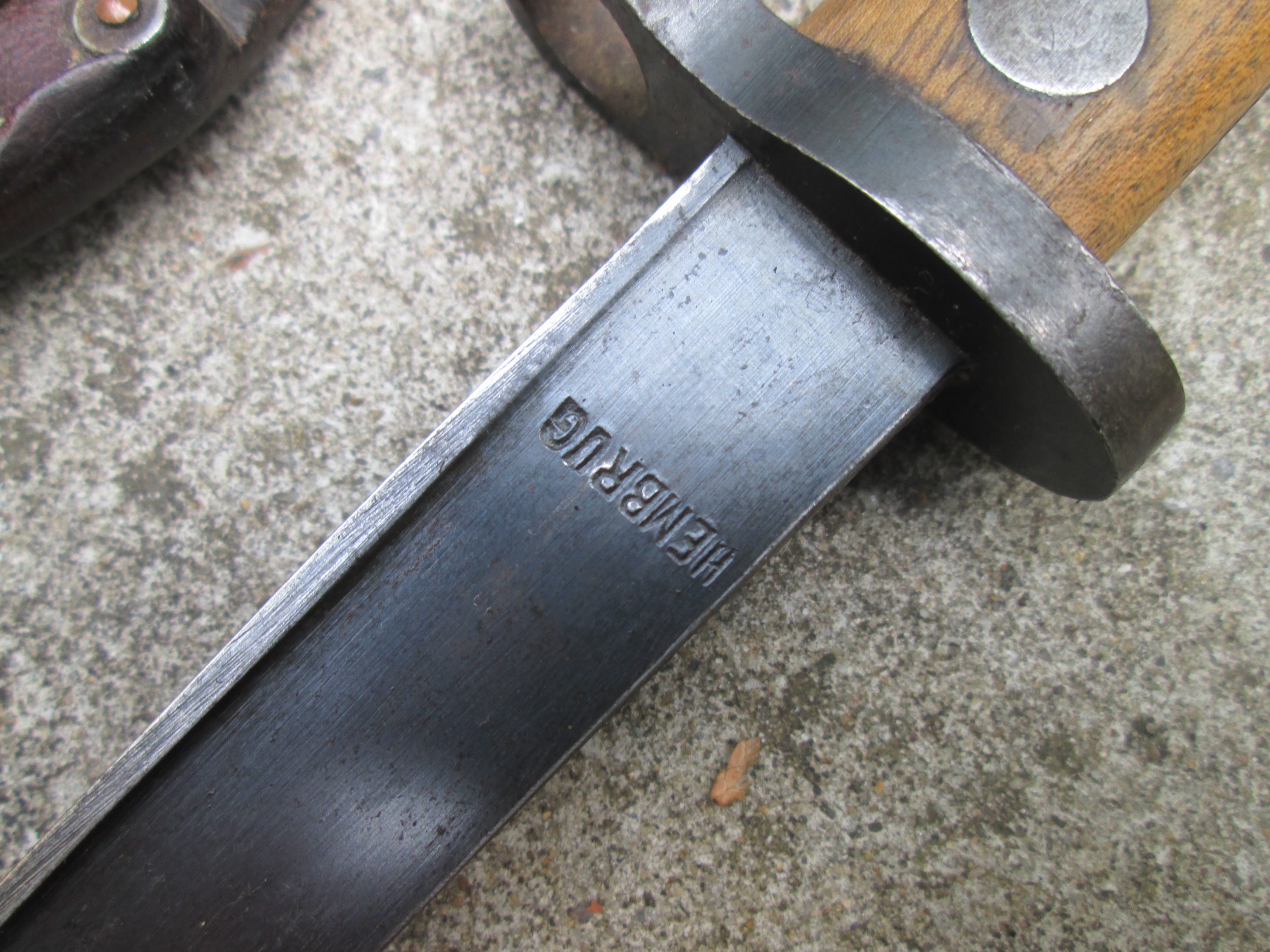 Dutch HEMBRUG bayonet with leather scabbard.