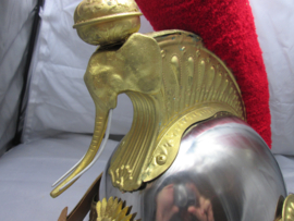 Ceremonial helmet of the Ivory Coast. Looks like the French Curasier helmet.  Republique de Cote  d'Ivoire. Parade helm prototype Ivoorkust, met i.p.v. Medusa hoofd een olifanten kop met slagtanden zeer bijzonder.