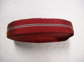 German ribbon for the miniature Ostfront medal. Rolletje medaille lint voor de miniatuur Ostfront medaille