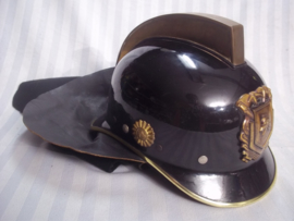 Dutch fire department helmet from the seventies. Nederlandse brandweerhelm uit de jaren  70, compleet met leren flap en brandwerende hoes, zeer goede staat.