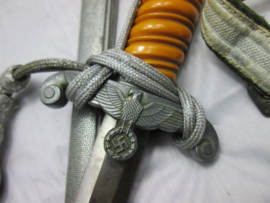 German Army dagger. Duitse Wehrmacht ponjaard, sierdolk, met gehäng en troddel, mooi compleet maker is W.K.C.- Solingen, mooi met de oranje grip.