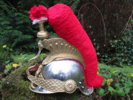 Ceremonial helmet of the Ivory Coast. Looks like the French Curasier helmet.  Republique de Cote  d'Ivoire. Parade helm prototype Ivoorkust, met i.p.v. Medusa hoofd een olifanten kop met slagtanden zeer bijzonder.