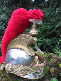 Ceremonial helmet of the Ivory Coast. Looks like the French Curasier helmet.  Republique de Cote  d'Ivoire. Parade helm prototype Ivoorkust, met i.p.v. Medusa hoofd een olifanten kop met slagtanden zeer bijzonder.