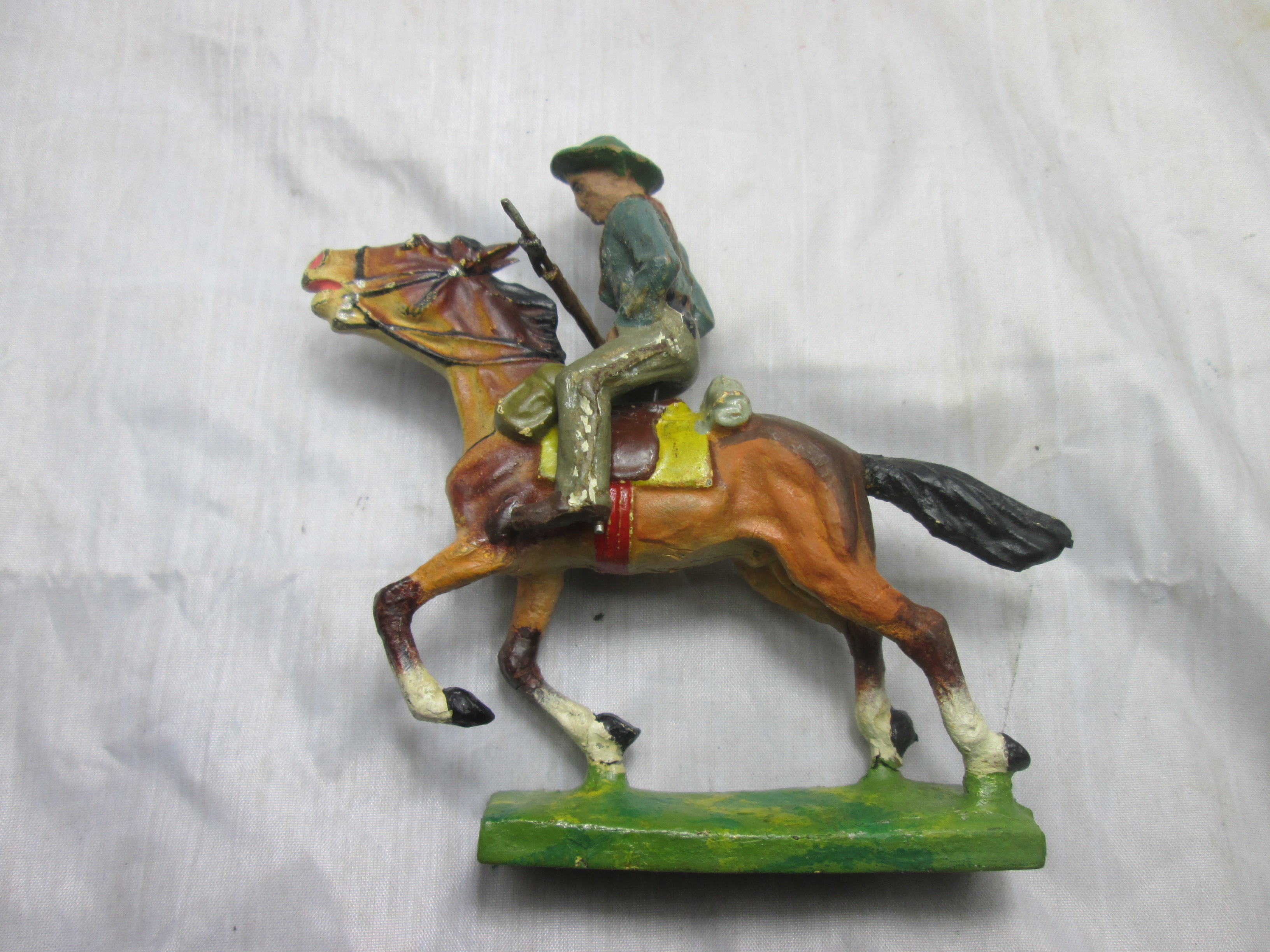 LINEOL cowboy on his horse. Cowboy op zijn paard