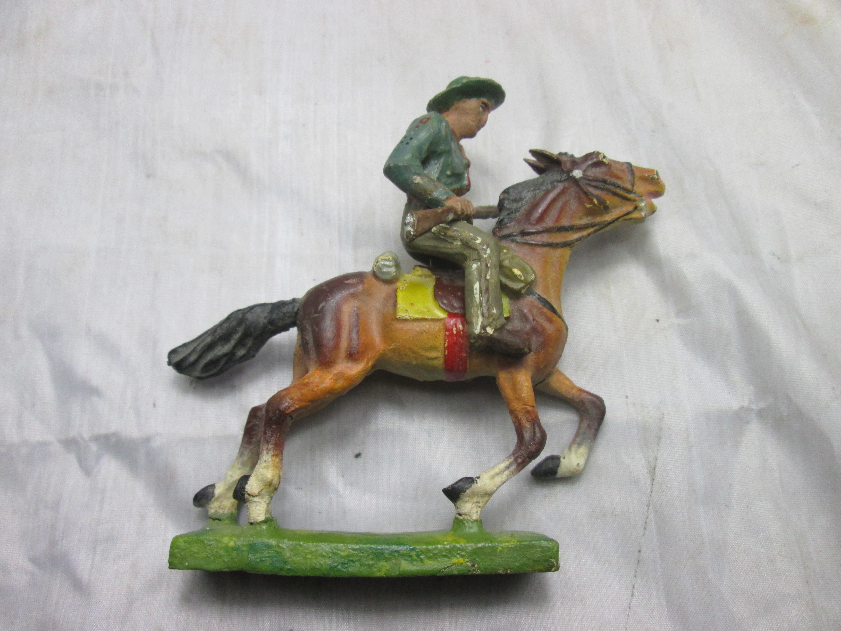 LINEOL cowboy on his horse. Cowboy op zijn paard