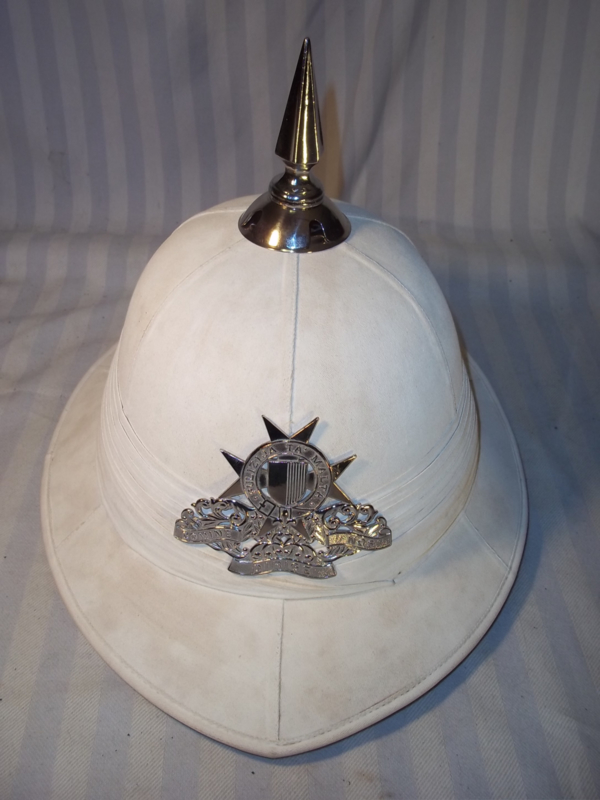 Pith helmet of the Malta Police, with silver chain badge and spike ...