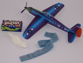 Vliegtuig met zakje snoep