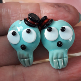 IKOC0215: DuoSet Schedels Halloween Turquoise, ca 26mm