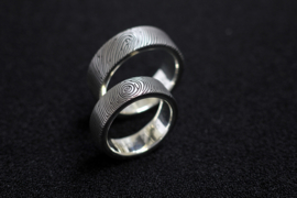Vingerafdruk ringen met zilveren binnenzijde en zirkonium blanke buitenzijde