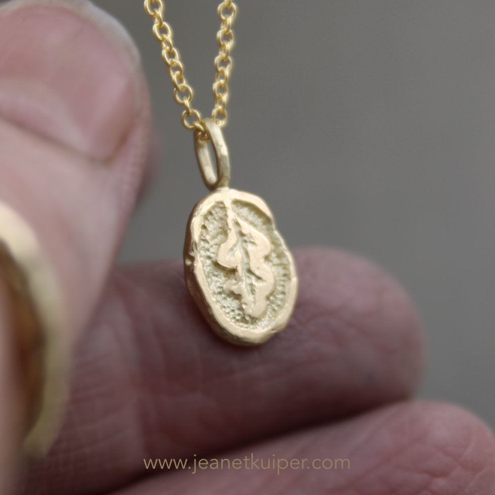 pendant with an oak leaf