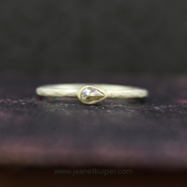 ring with a teardrop rose cut champagne diamond