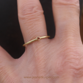 ring with an orange sapphire