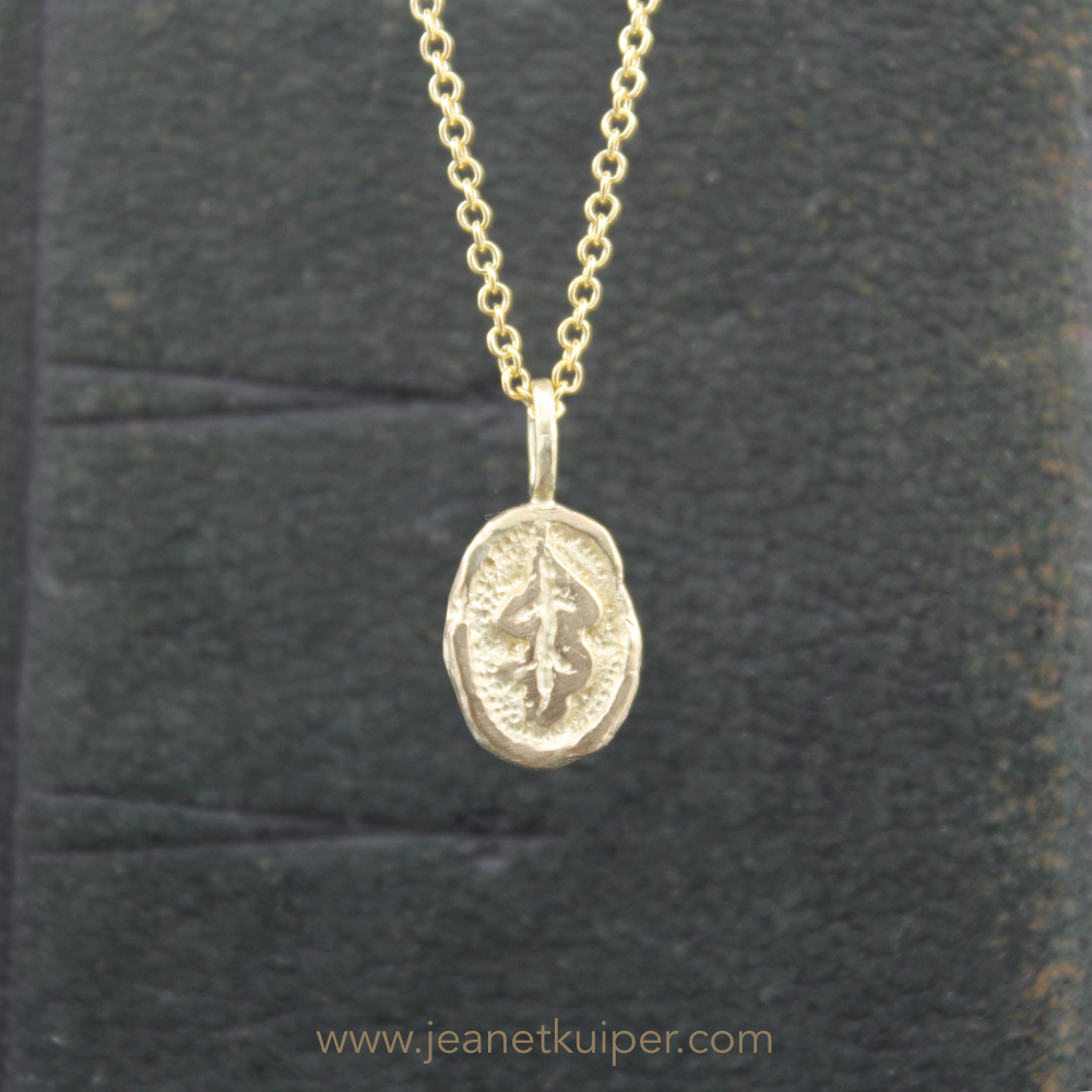 pendant with an oak leaf