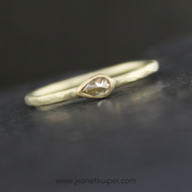 ring with a teardrop rose cut champagne diamond