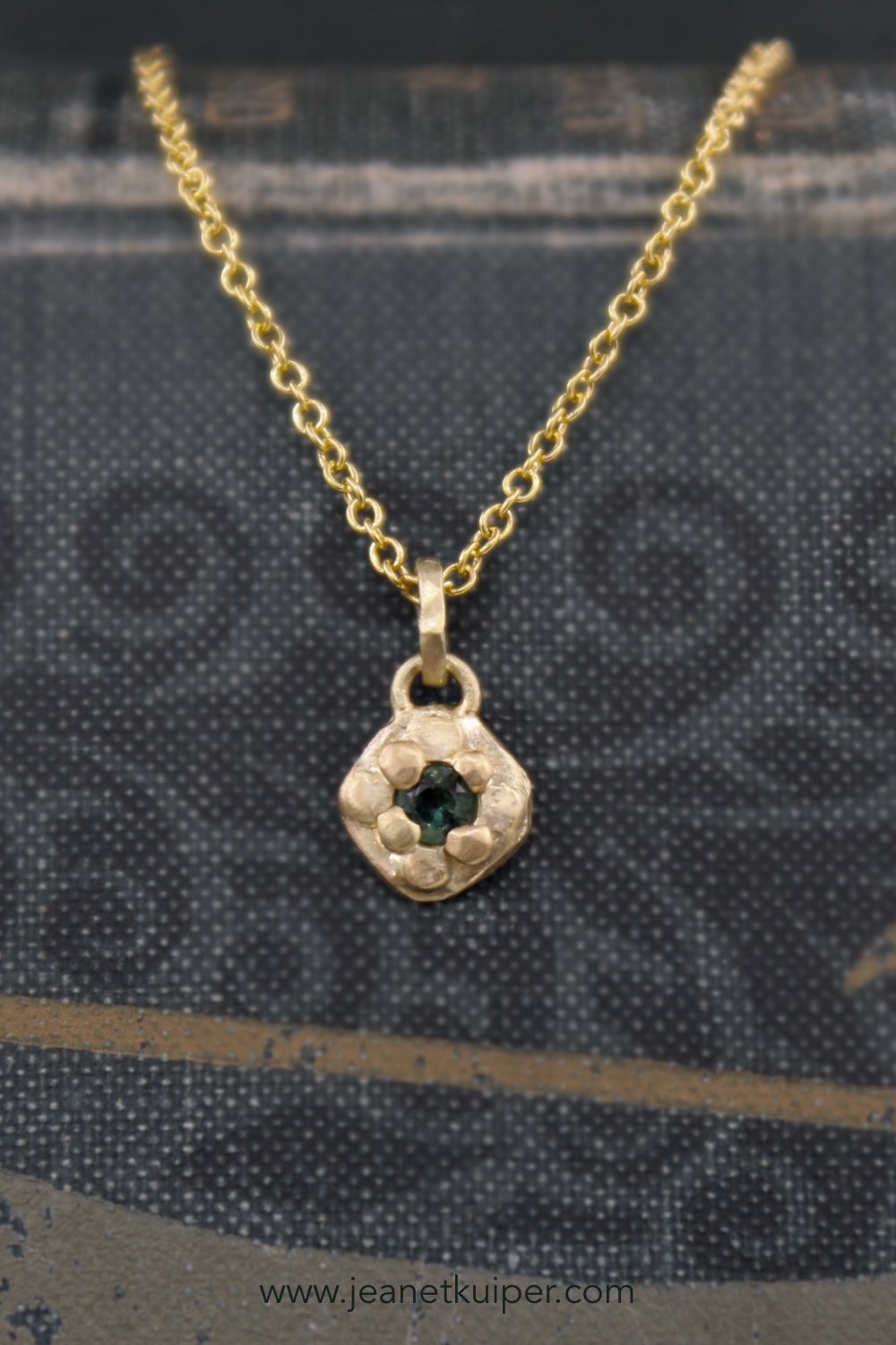 Pendant with a green-blue sapphire