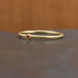 ring with an orange sapphire
