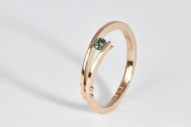 Rose golden ring with blue diamond