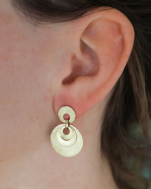 Golden earrings "out the middle"