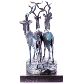 Drie bronzen antilopen beelden