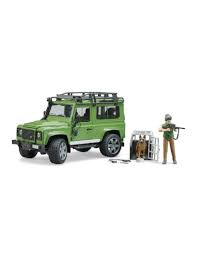 Land Rover Defender Station Wagon met boswachter en hond