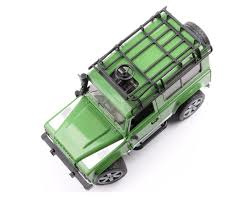 Land Rover Defender Station Wagon met boswachter en hond