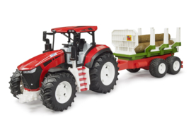 Tractor met boomstammenaanhanger
