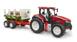 Tractor met boomstammenaanhanger