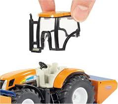 Tractor met schuif en strooier