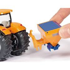 Tractor met schuif en strooier